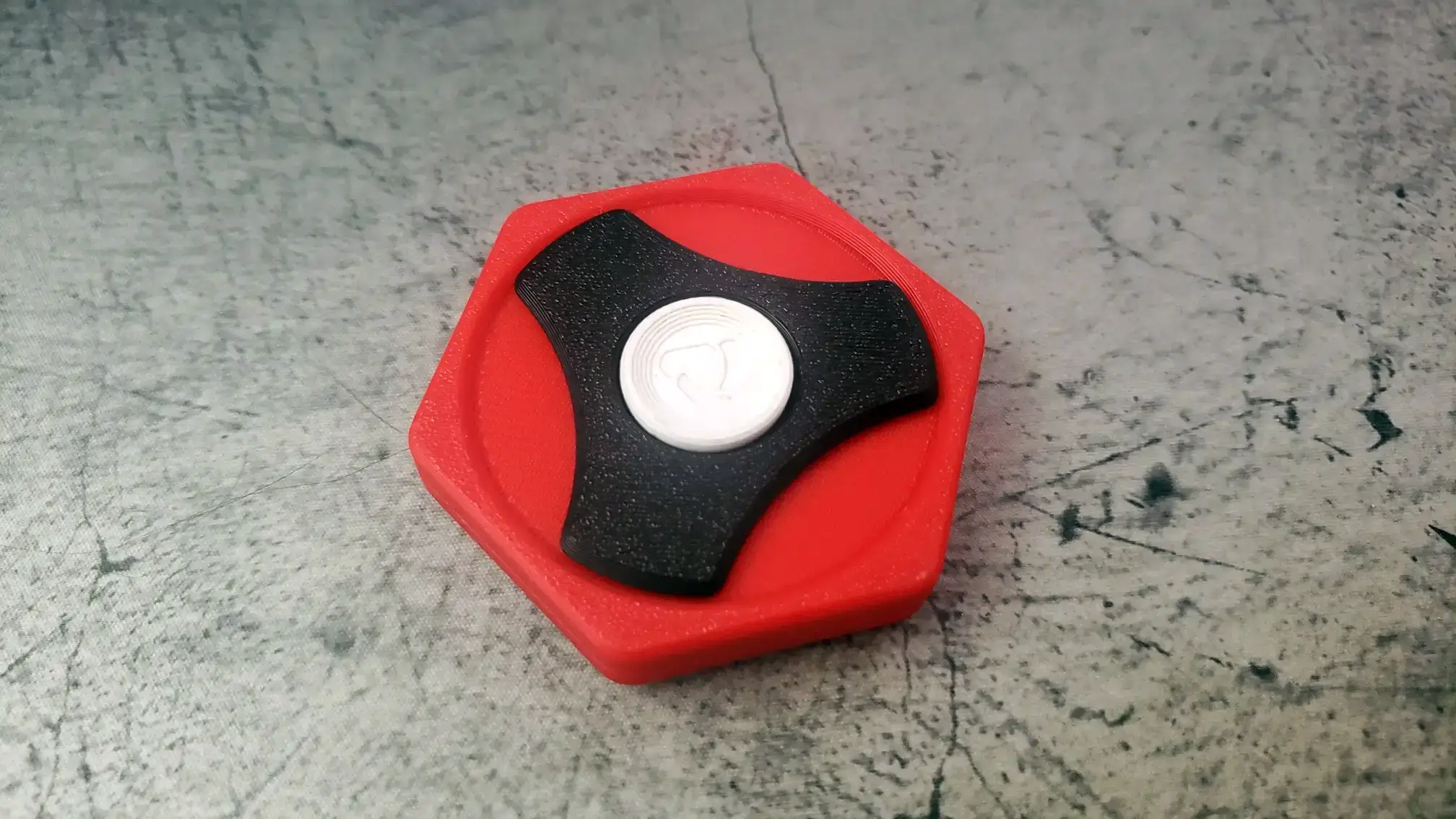 Red, black, and white spinner